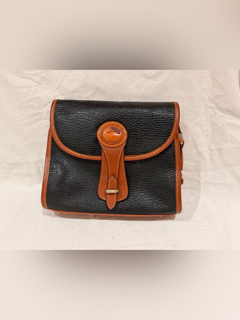 Dooney & Bourke Black with Brown Trim Leather Crossbody Bag